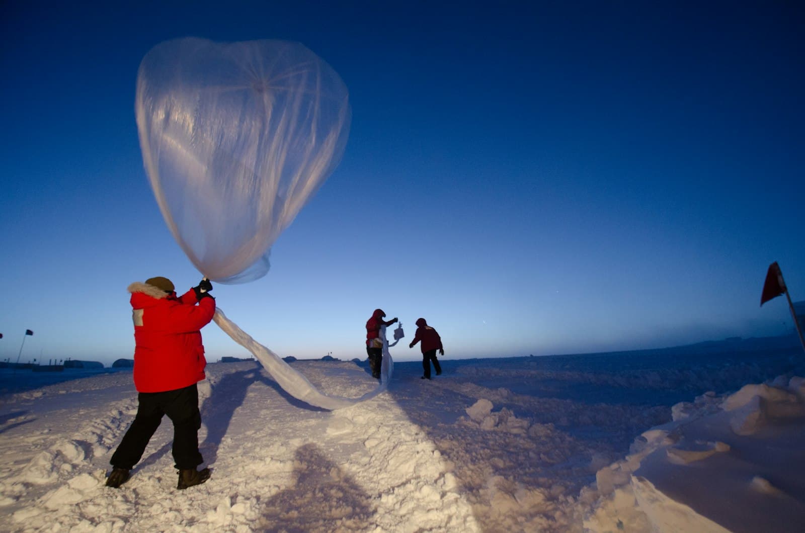Researcher launching a high-altitude sounding balloon