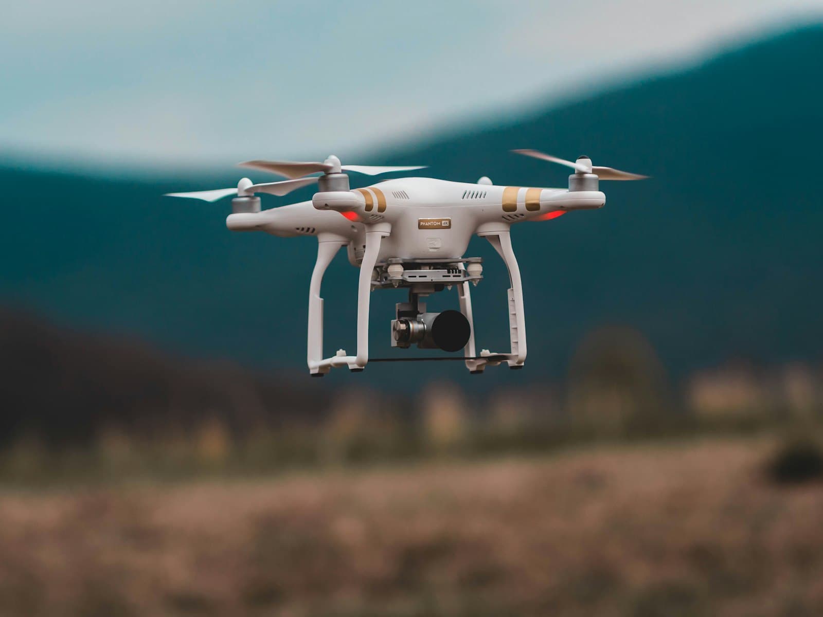 Quadcopter drone in sharp focus during flight